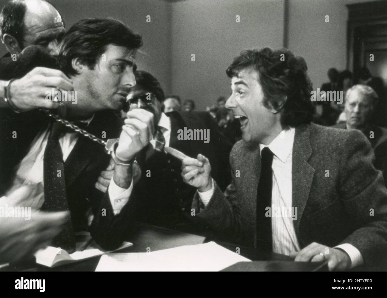 Actors Dudley Moore (right) and Armand Assante in the movie