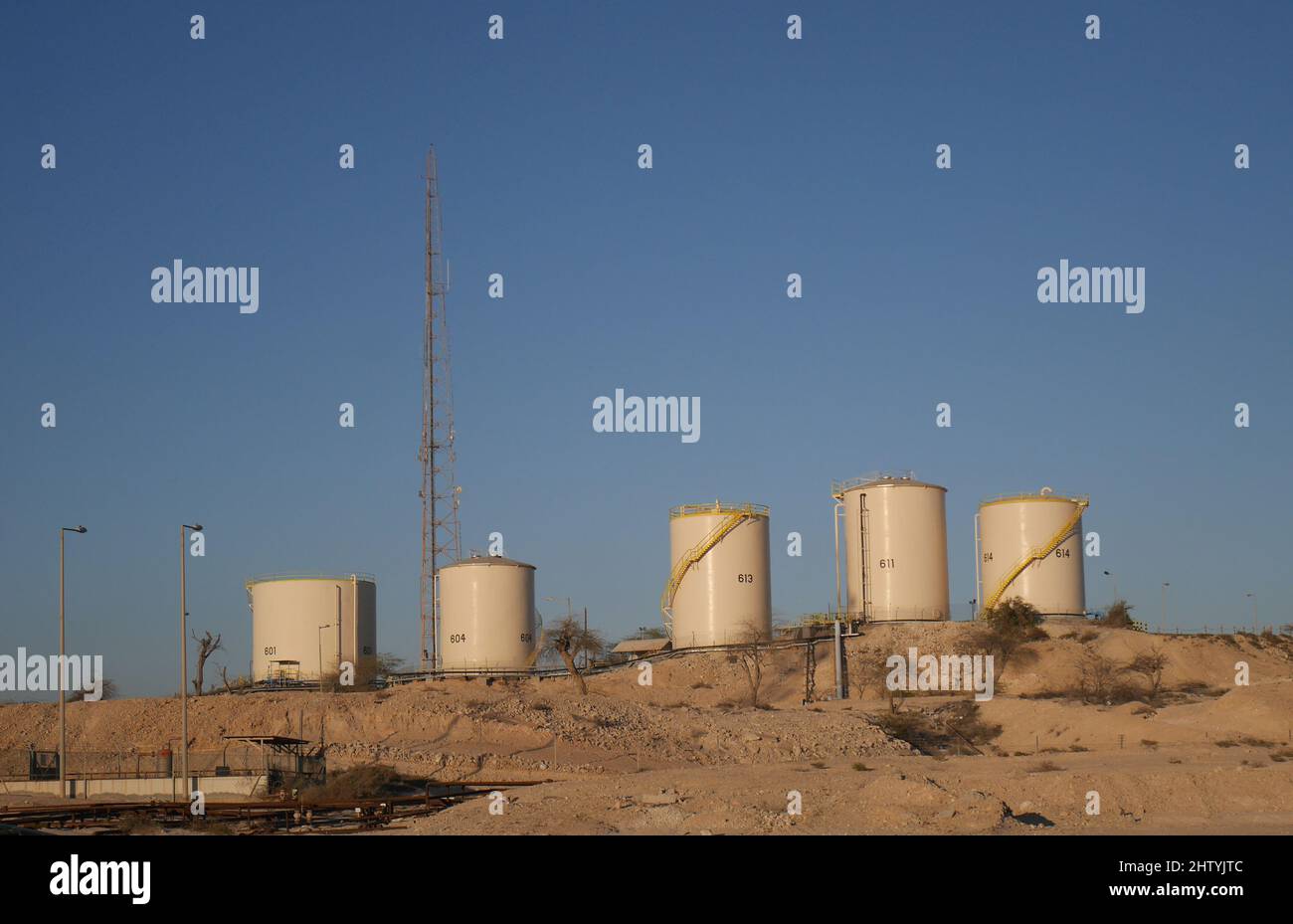 Oil storage tanks in the desert, Kingdom of Bahrain Stock Photo