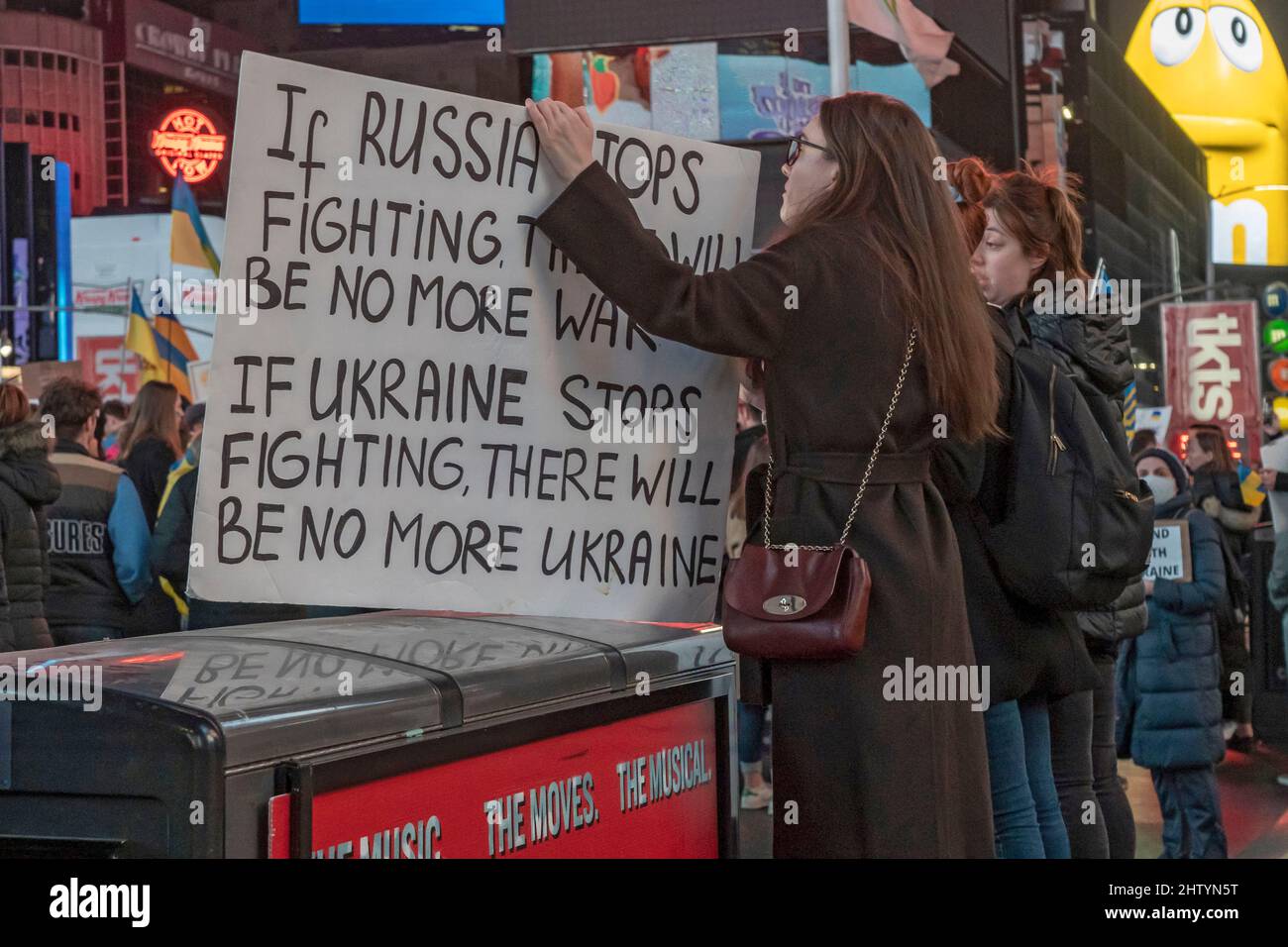 New York, United States. 02nd Mar, 2022. A protester holds a placard reading 'if Russia stops fighting there will be no more war, if Ukraine stops fighting there will be no more Ukraine' during the 'Stand with Ukraine' rally in Times Square.Ukrainians, Ukrainian-Americans and allies gathered to show support for Ukraine and protest against the Russian invasion in New York City. Credit: SOPA Images Limited/Alamy Live News Stock Photo