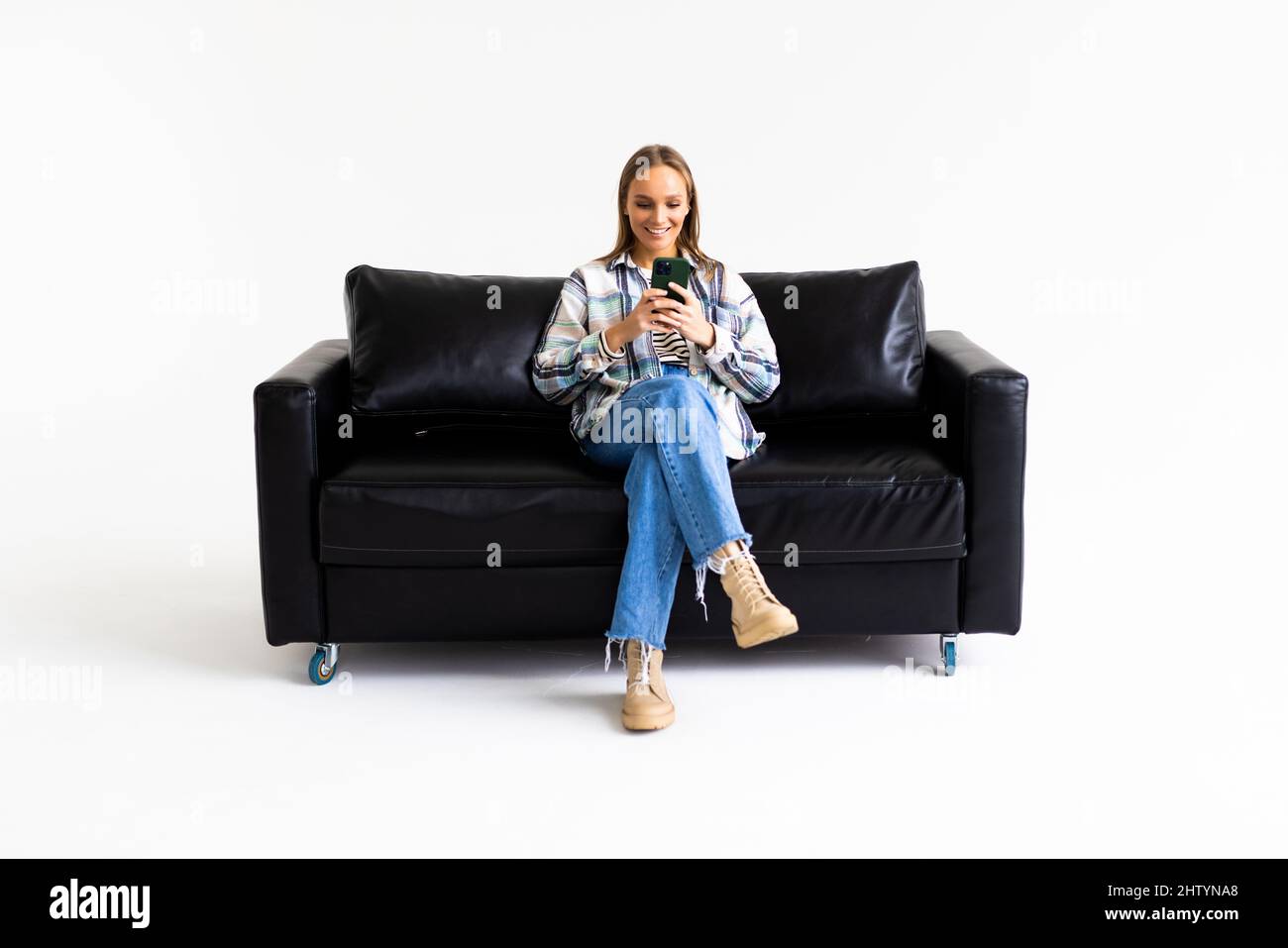 Young woman lying a couch Cut Out Stock Images & Pictures - Alamy