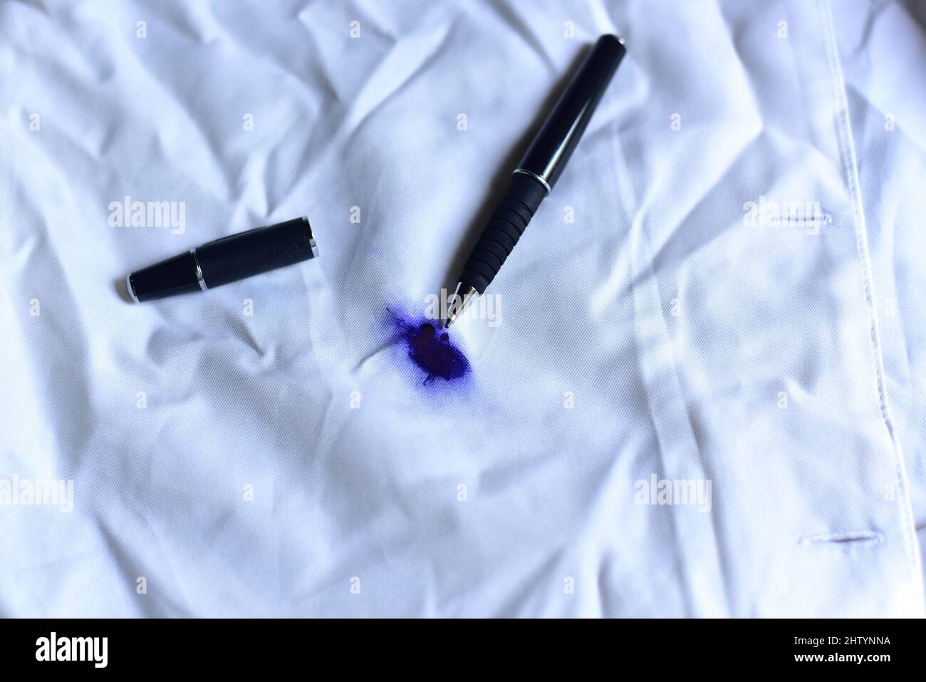 Dirty pen ink stain on fabric from accident in daily life. Concept of