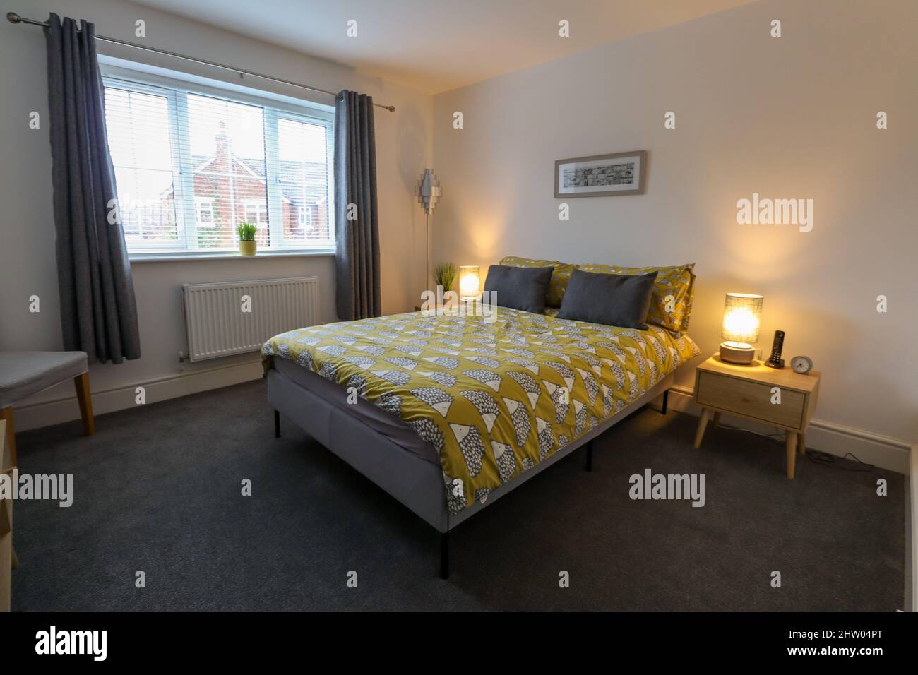 Interior bedroom shot in modern house with hedgehog bedding Stock Photo