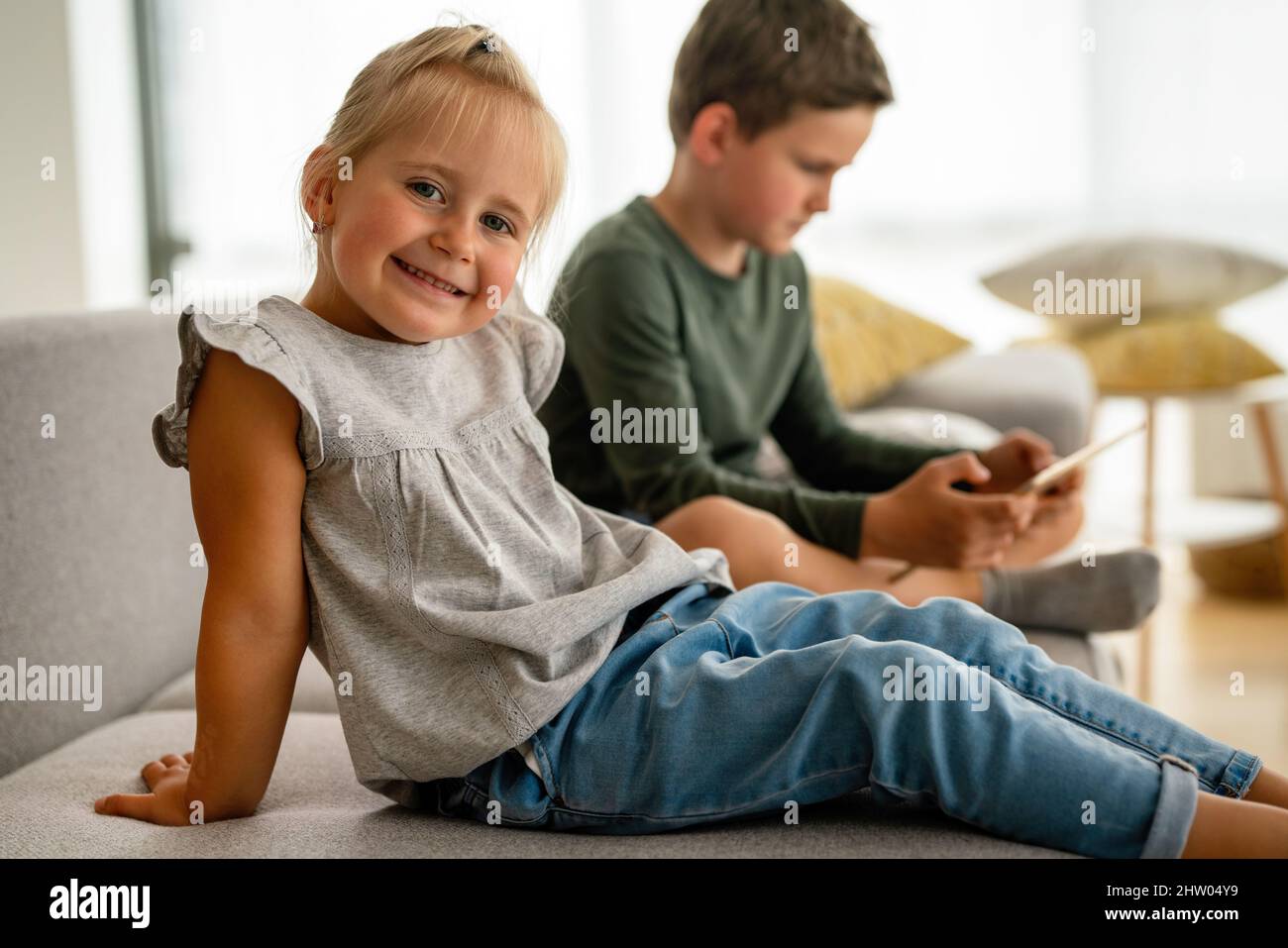 Portrait of happy little girl smiling and having fun at home. Stock Photo