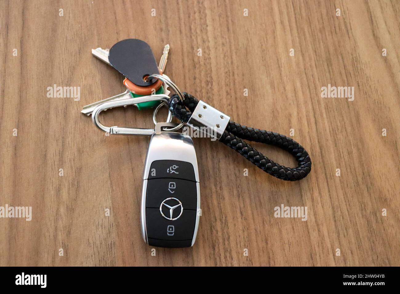 Keys, key loop with Mercedes Benz car key with various house keys and fob Stock Photo
