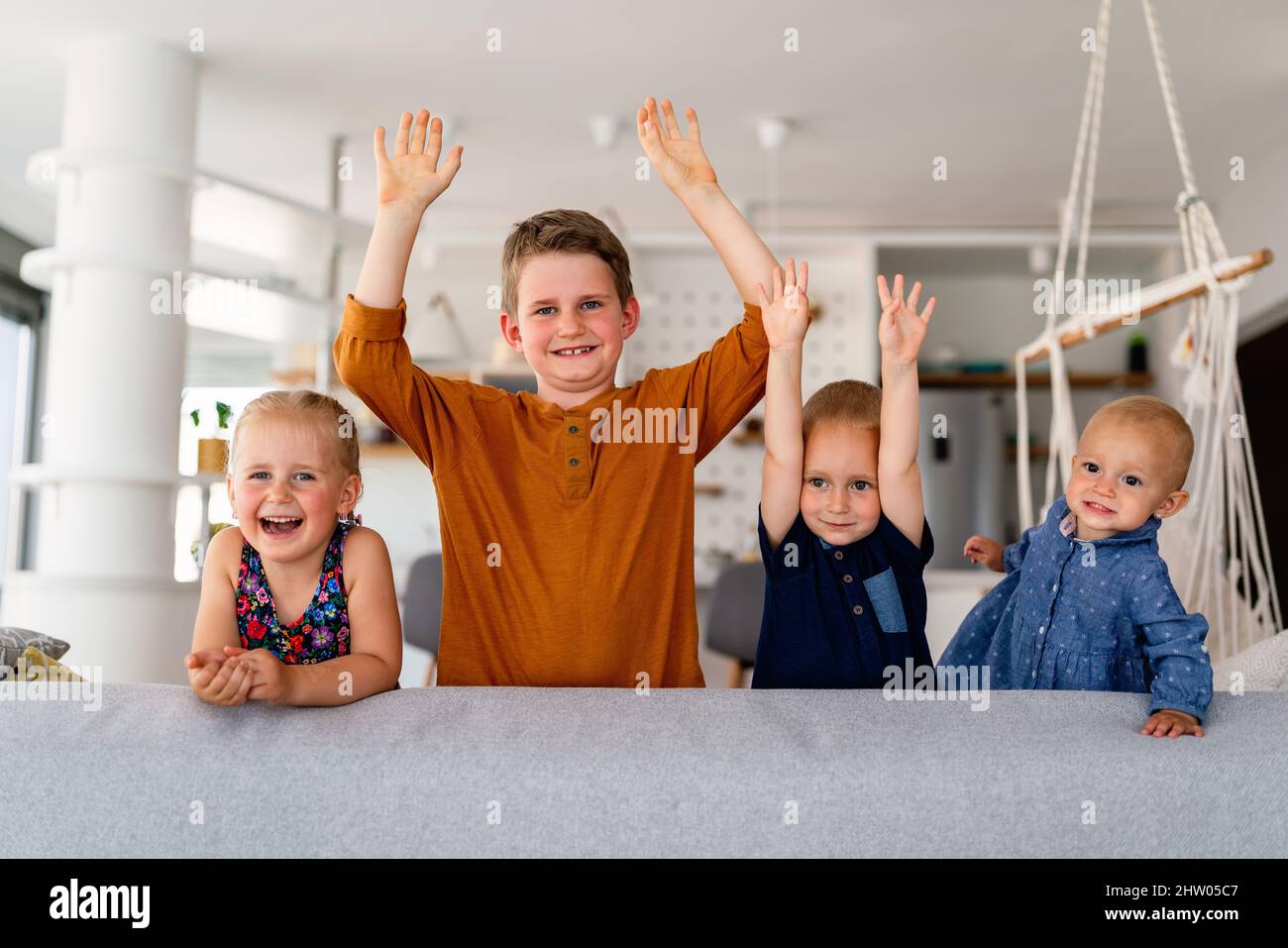 Group of little children having fun and smiling together indoors. Stock Photo