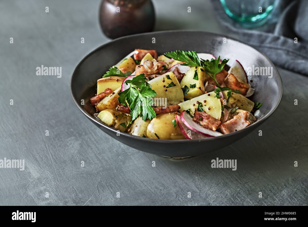 Potato with Bacon, Radish Salad in a bowl Stock Photo
