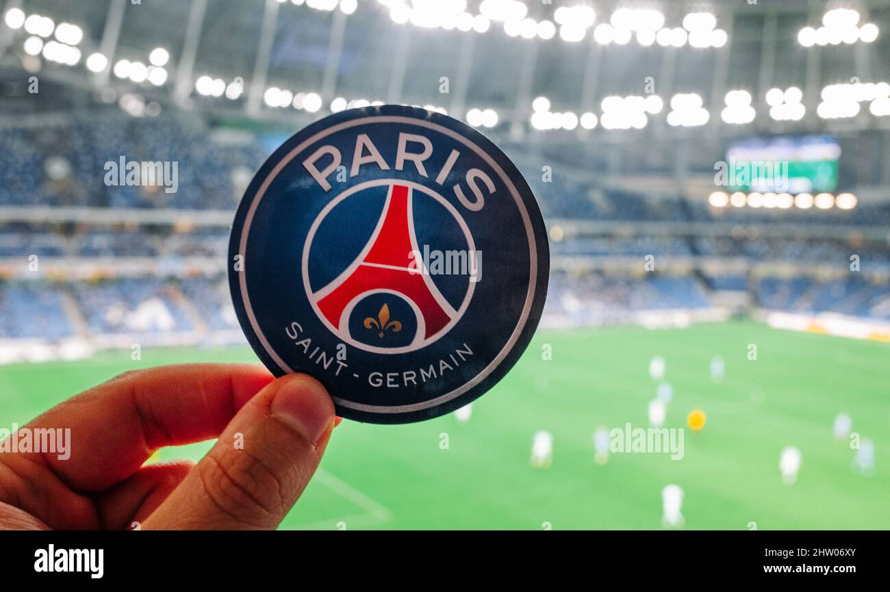 August 30, 2021, Paris, France. The emblem of the football club Paris Saint-Germain F.C. against the backdrop of a modern stadium. Stock Photo