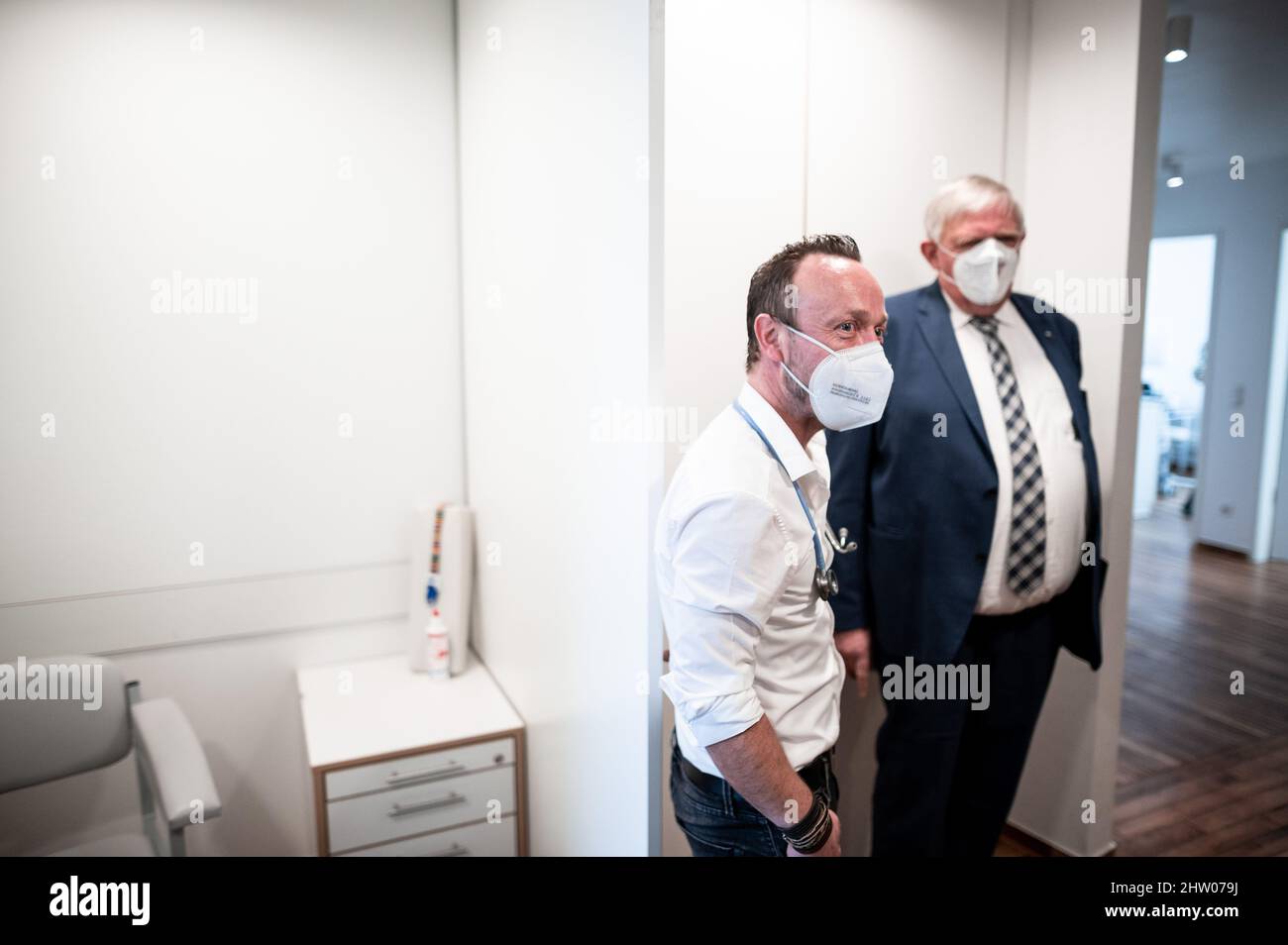 Krefeld, Germany. 03rd Mar, 2022. Physician Christian Einfalt (l) and Karl-Josef Laumann (CDU), Minister of Health of North Rhine-Westphalia, stand in the rooms of Einfalt's practice. The minister visits the family doctor's practice to get an idea of vaccination activities and the day-to-day work. Credit: Fabian Strauch/dpa/Alamy Live News Stock Photo