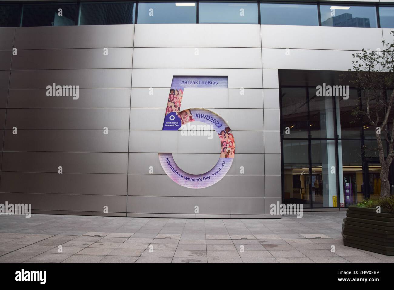 London, UK. 3rd March 2022. The number 5 sign outside the headquarters of UBS at 5 Broadgate is adorned with a celebration of International Women's Day, which takes place on 8th March. Credit: Vuk Valcic / Alamy Live News Stock Photo