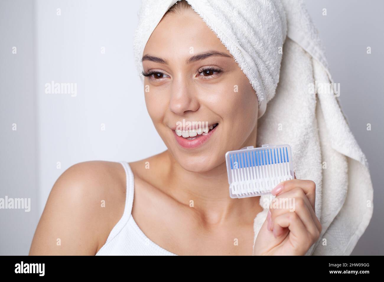 The woman uses brushes to clean the interdental spaces Stock Photo Alamy