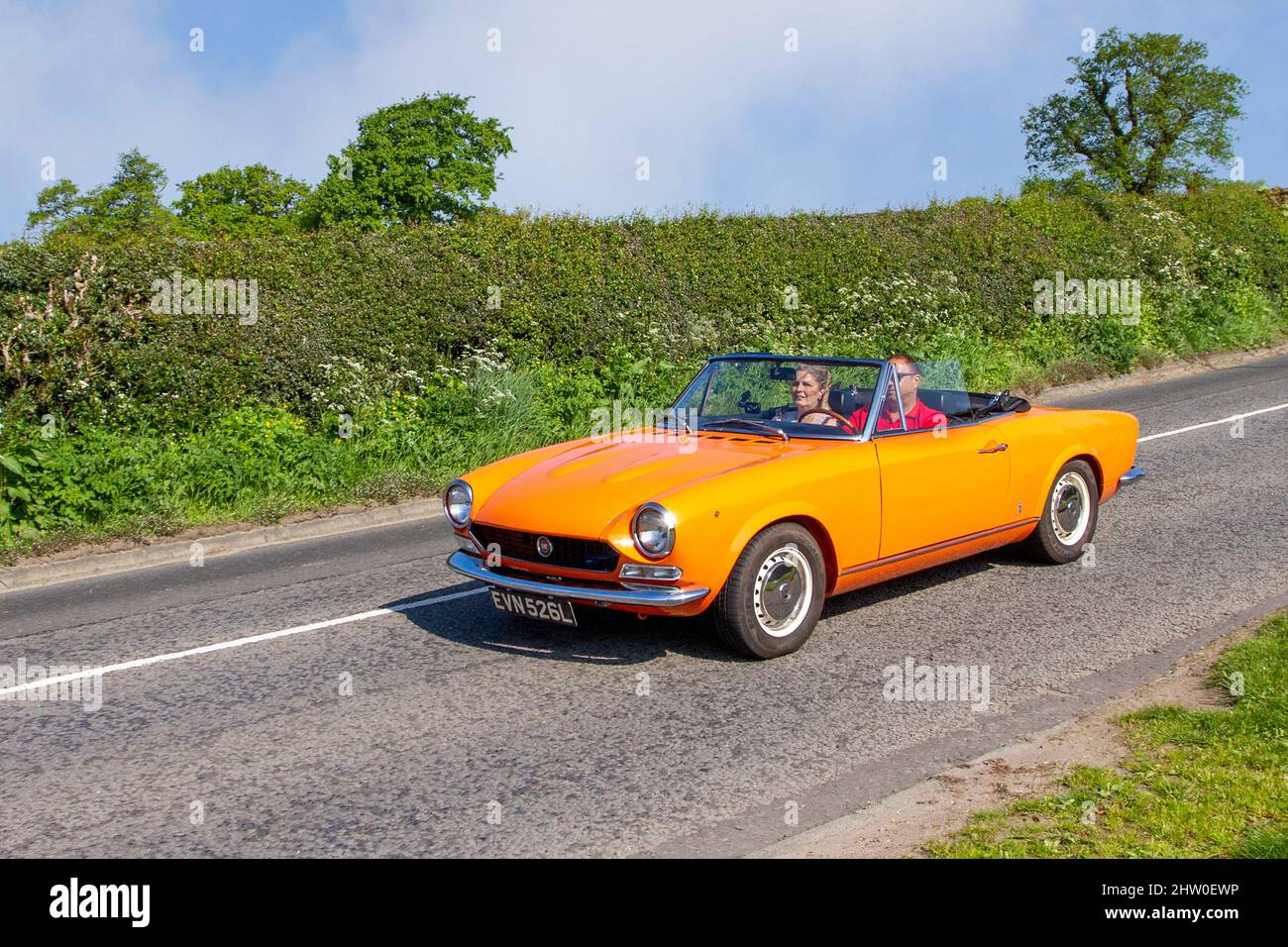 1973 70s seventies Orange Italian Fiat 1592cc left-hand drive petrol  cabriolet en-route to Capesthorne Hall classic May car show, Cheshire, UK  Stock Photo - Alamy