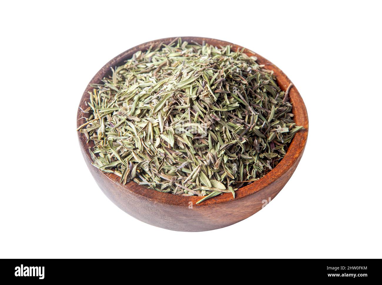 Dried organic thyme in bowl on white background Stock Photo