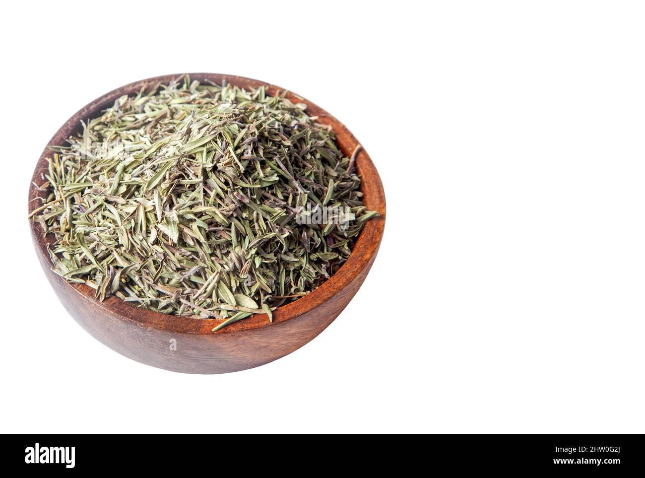 Dried organic thyme in bowl on white background Stock Photo