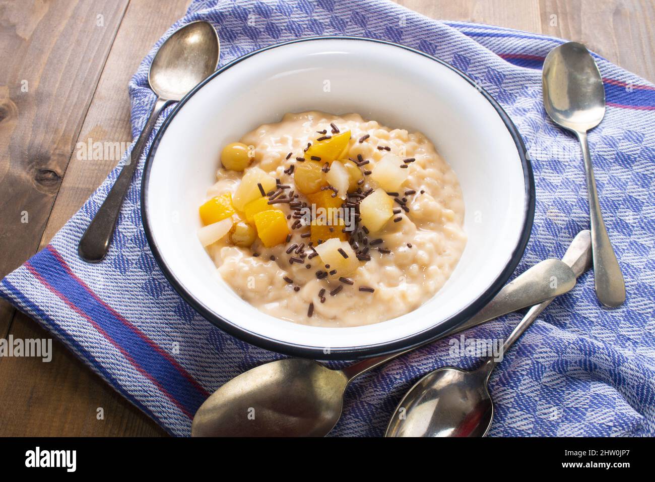 rice pudding with fruit cocktail and chocolate sprinkles in a bowl Stock Photo