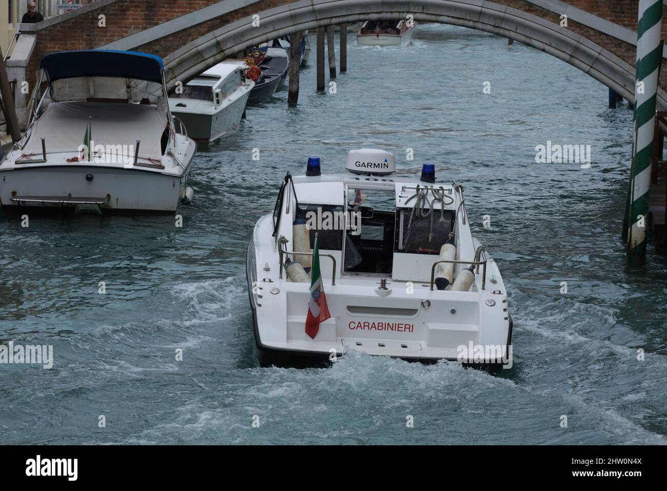 Carabinieri speedboat rushing along canal in venice Stock Photo - Alamy