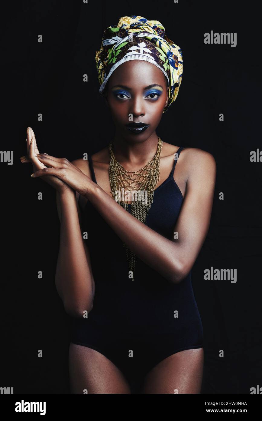 Shes a true african beauty. A beautiful african woman posing against a ...