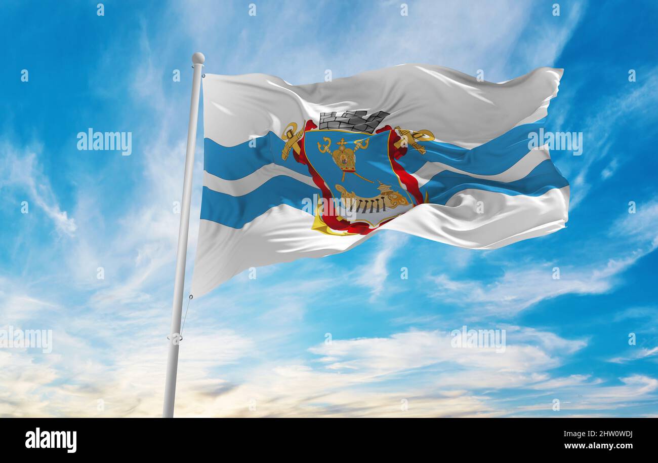 flag of Mykolaiv , Ukraine at cloudy sky background on sunset, panoramic view. Ukrainian travel and patriot concept. copy space for wide banner. 3d il Stock Photo