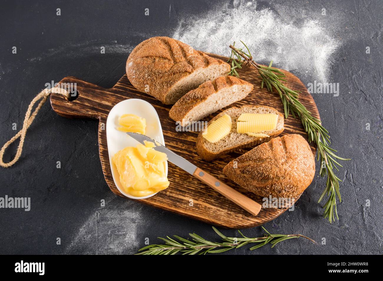 delicious homemade bread with bran on a wooden village board with