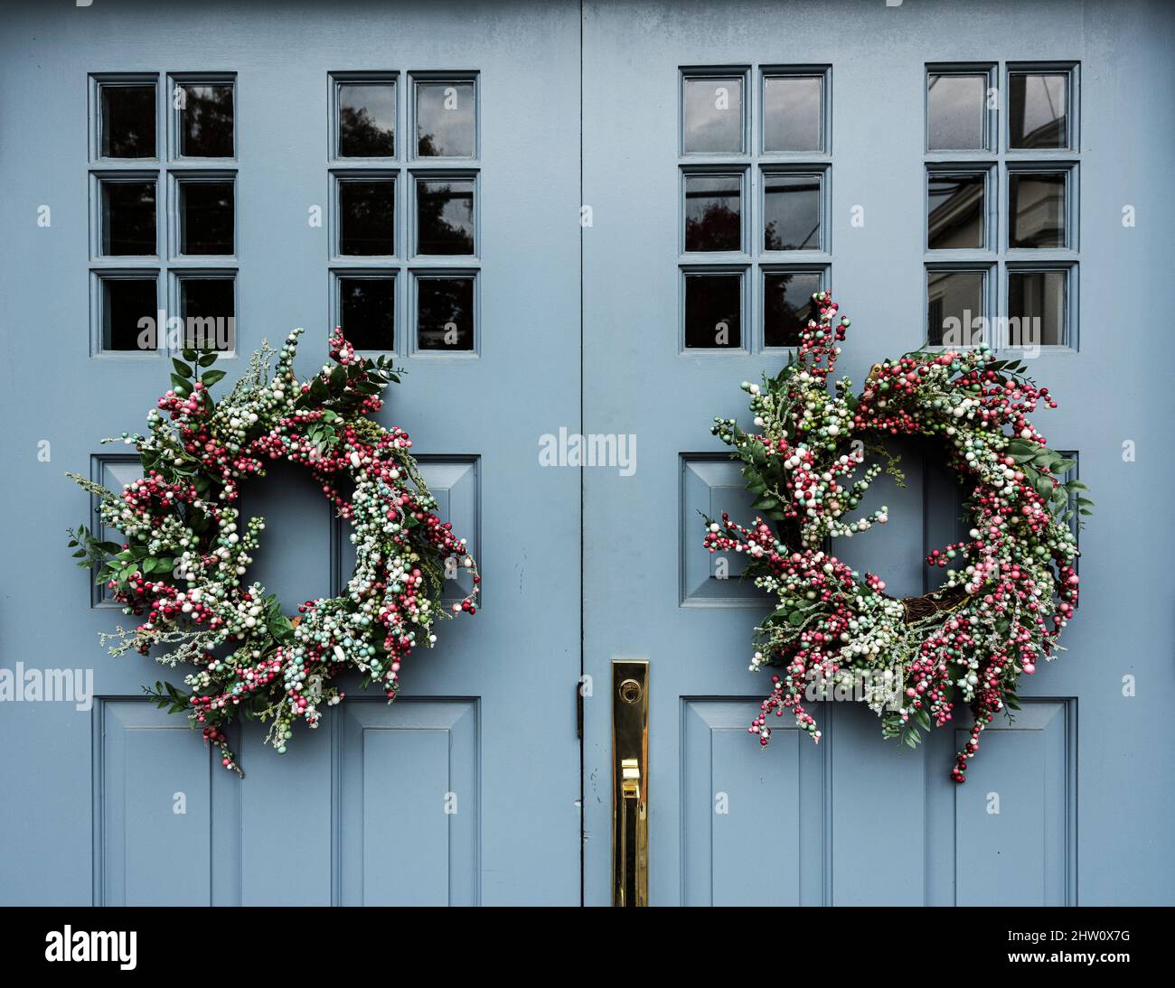 Rural door with decorative Christmas wreaths, Martha's Vineyard, Massachusetts, USA. Stock Photo