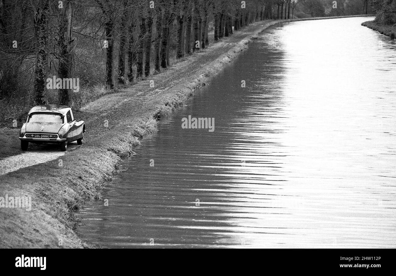 1964 Citroen DS19 driving by the Burgundy canal France Stock Photo