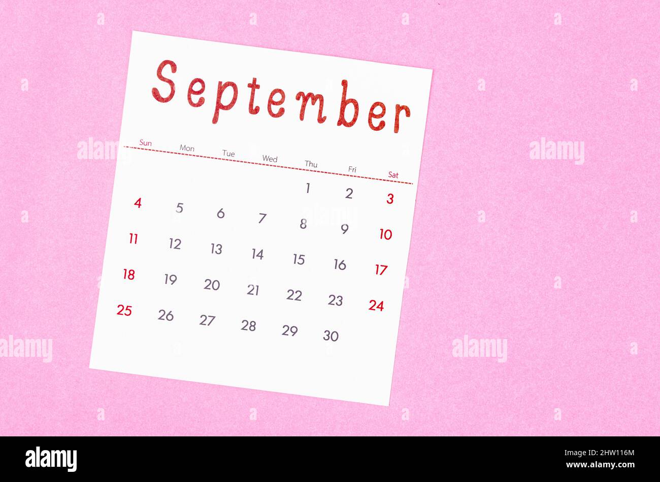 The September 2022 calendar on pink background with empty space. Stock Photo