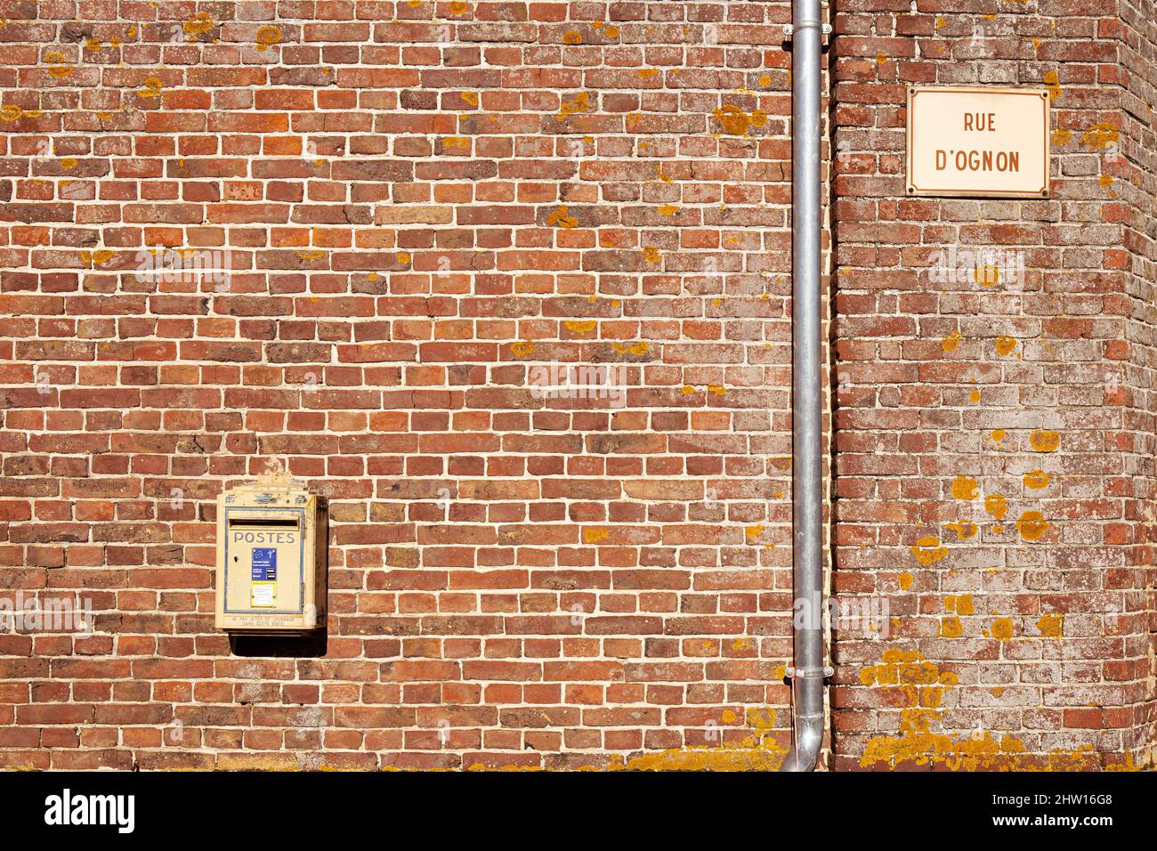 Official french mail boxes on a brick wall Stock Photo