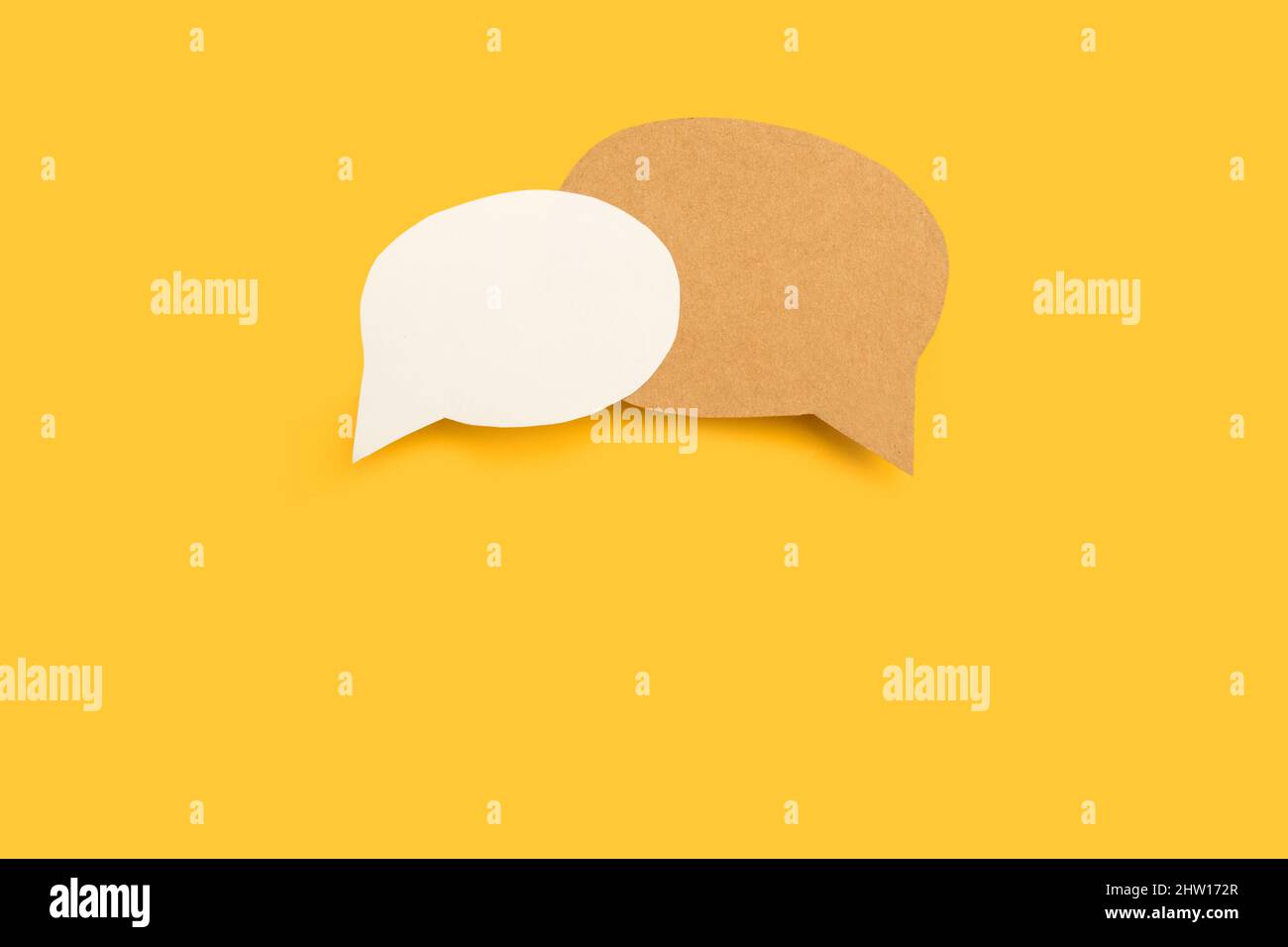 Blank speech bubbles with copy space on a yellow background Stock Photo