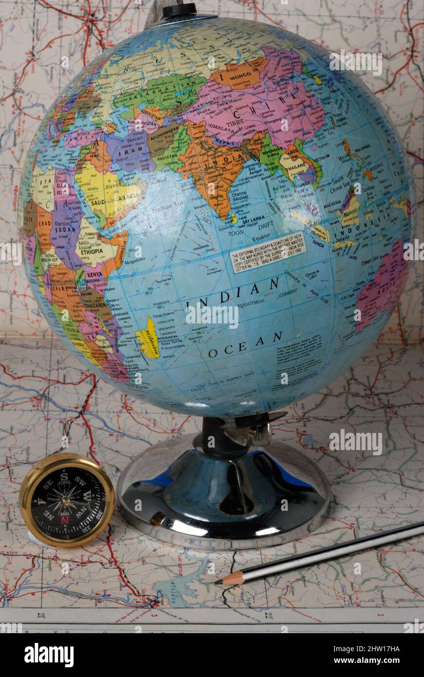 Mumbai, Maharashtra, India, Asia, July. 03, 2006 - Orientation Concept Earth and Compass on a world map Stock Photo