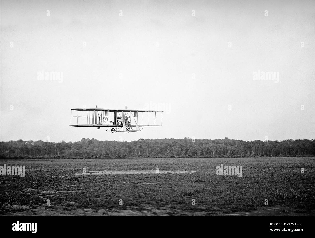 An early 20th century photograph of a Wright Biplane Type B flown by Lt Harry Graham at College Park Aviation Field in Maryland, United States of America. The Wright Machine invented and developed by the Wright brothers, Orville and Wilbur, American aviation pioneers who are generally credited with inventing aircraft controls that made fixed-wing powered flight possible enabling the first controlled, sustained flight of a powered, heavier-than-air aircraft with the Wright Flyer on December 17, 1903. Stock Photo