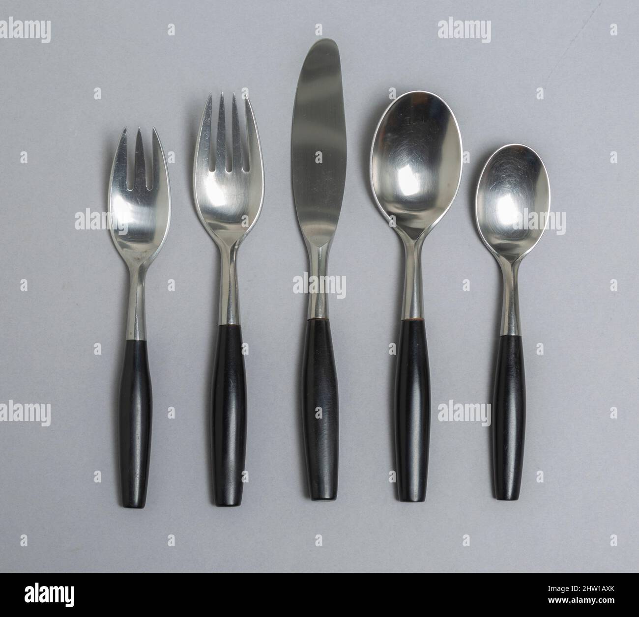 Kongo, by Dansk cutlery, 5-piece place setting with black plastic handles, 1954 design by Jens Quistgaard, Germany Stock Photo