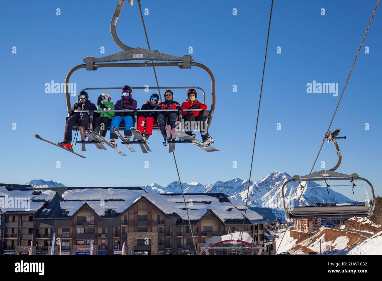 France, Hautes Pyrenees, winter sports resort of Peyragudes on the  Peyresourde side, skiers on the chairlift Stock Photo - Alamy