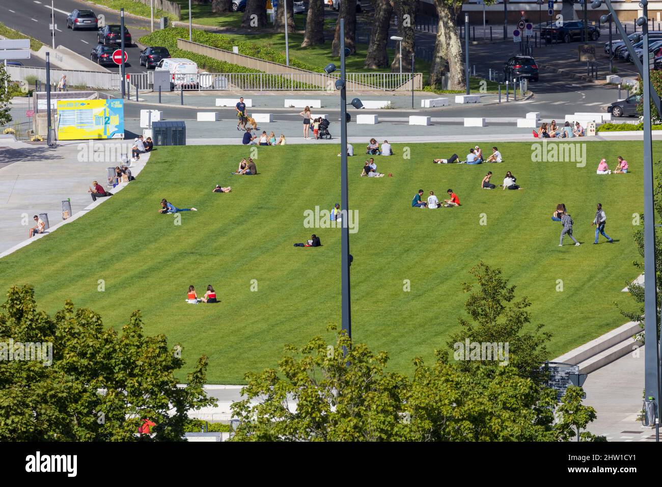 France, Maire-et-Loire, Loire valley listed as World Heritage by UNESCO, Angers, locals sunbathing on lawns bordering Maine Stock Photo