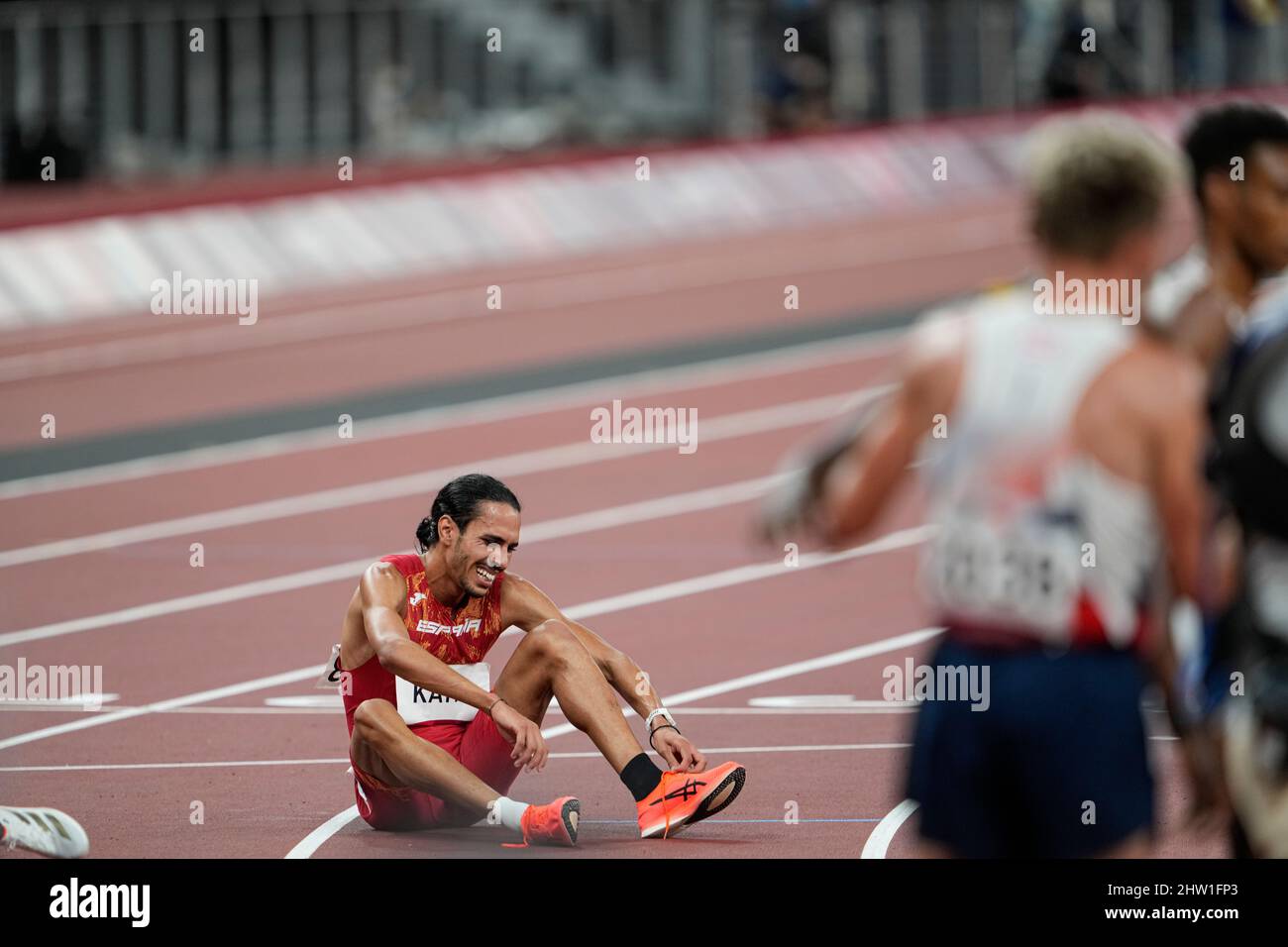 Mohamed Katir defeated and hugged at the finish line at the 2020 Tokyo ...