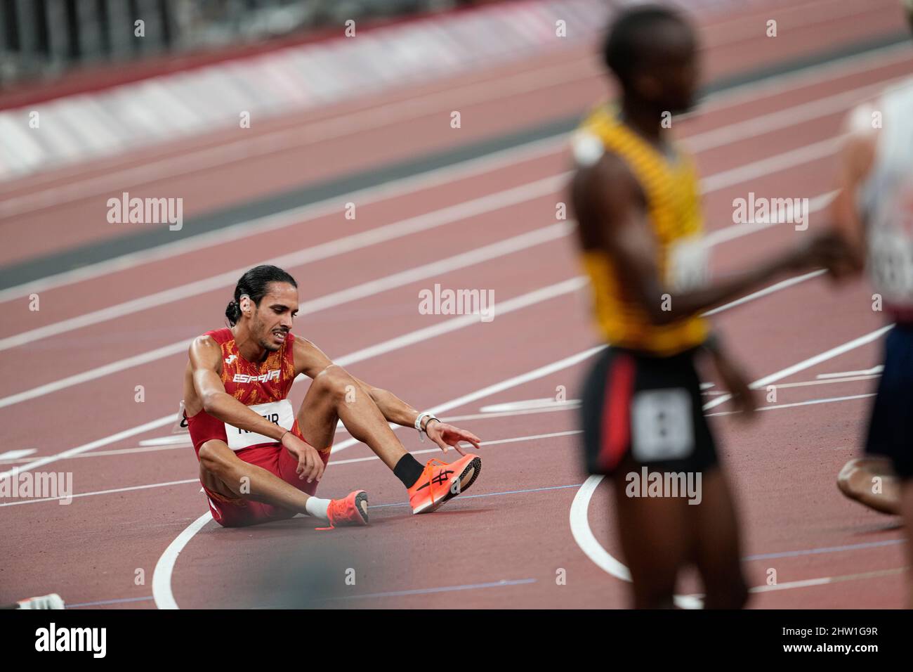 Mohamed Katir defeated and hugged at the finish line at the 2020 Tokyo ...