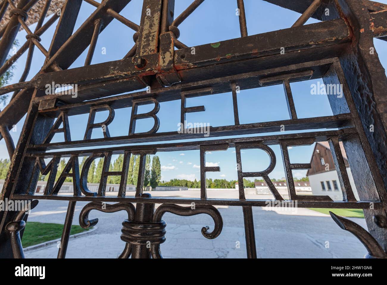 Germany, Bavaria, Dachau, Concentration Camp, entrance gate (Jourhaus), bearing the inscription Arbeit macht frei (Work makes one free), seen from outside the camp Stock Photo