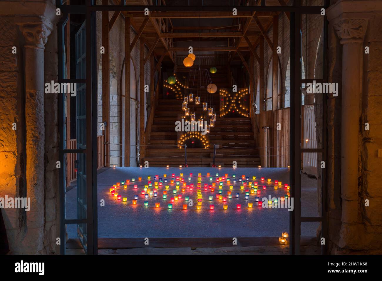 France, Indre et Loire, Loire valley listed as World Heritage by UNESCO, Chinon, Saint Mexme collegiate church, show 1000 and 1 lights by the collective Les Potes Aux Feu, illumination show with candles Stock Photo