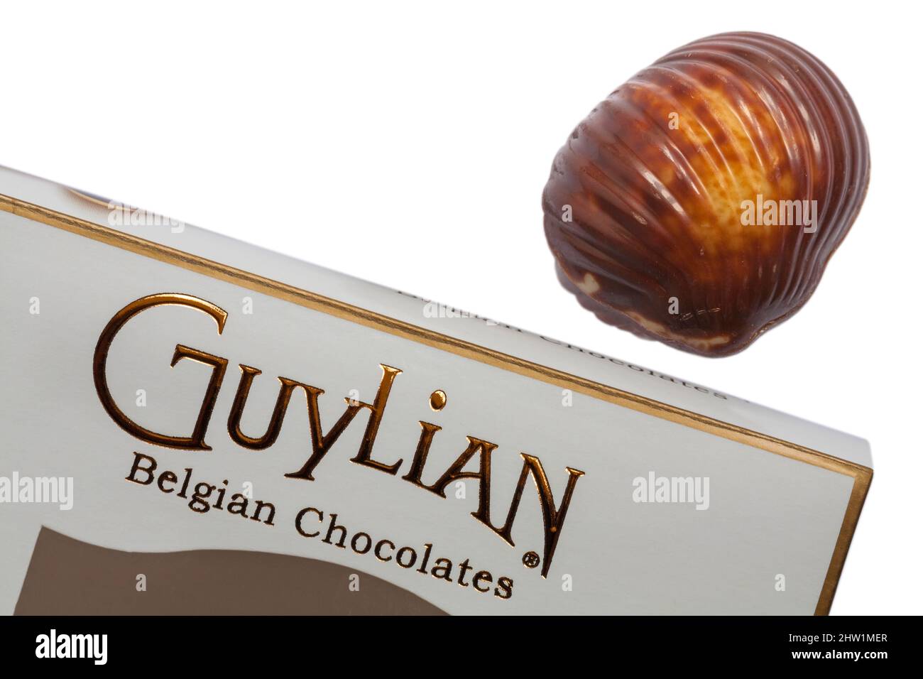 Guylian Belgian chocolates seashells chocolate seashell with box set on white background - finest Belgian chocolates with hazelnut praline filling Stock Photo