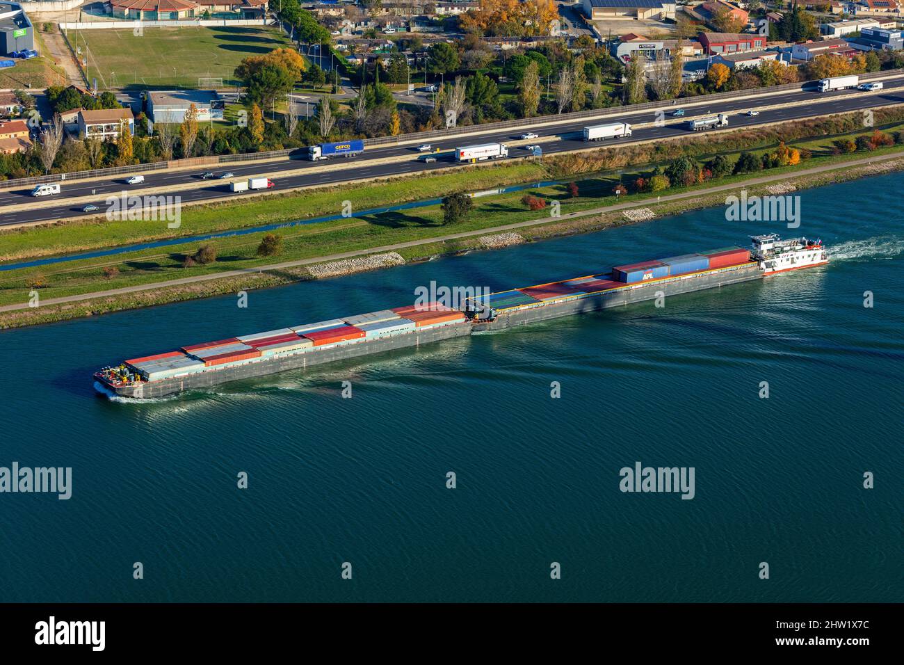 France, Vaucluse, Bollene, barge on Le Rhone, container transport, A7 Sun highway (aerial view) Stock Photo