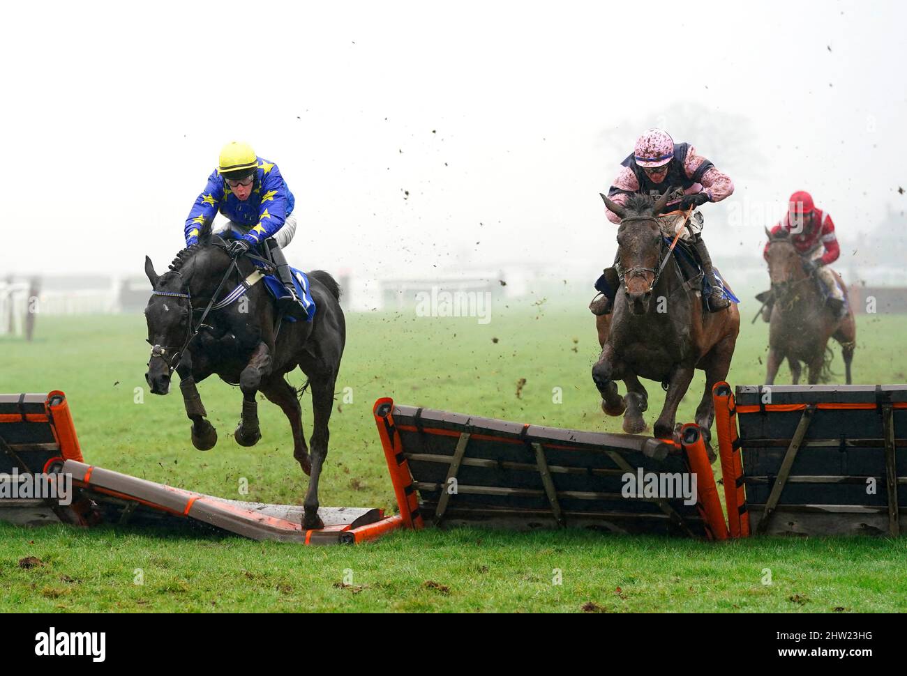 Come On Gruff ridden by jockey Jonathan Burke (right, pink silks) on their way to winning the Wye Valley Brewery Novices’ Handicap Hurdle at Ludlow Racecourse. Picture date: Thursday March 3, 2022. Stock Photo