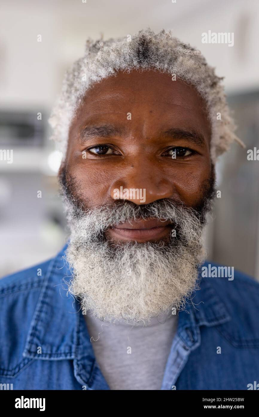 Close-up portrait of senior african american man white hair and beard at home Stock Photo
