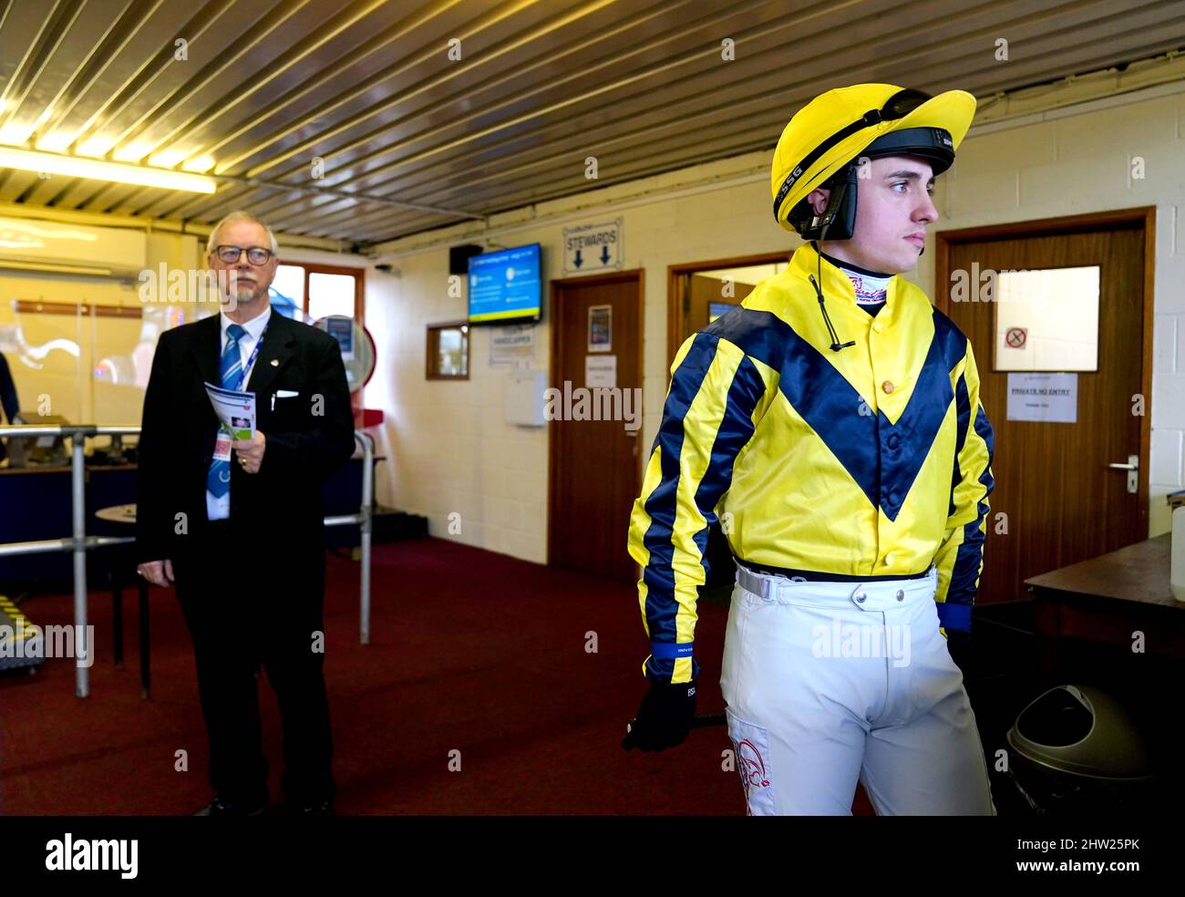 Jockey Charlie Hammond makes his way out ahead of the Alan Bore Belated 50th Birthday Novices' Hurdle at Ludlow Racecourse. Picture date: Thursday March 3, 2022. Stock Photo