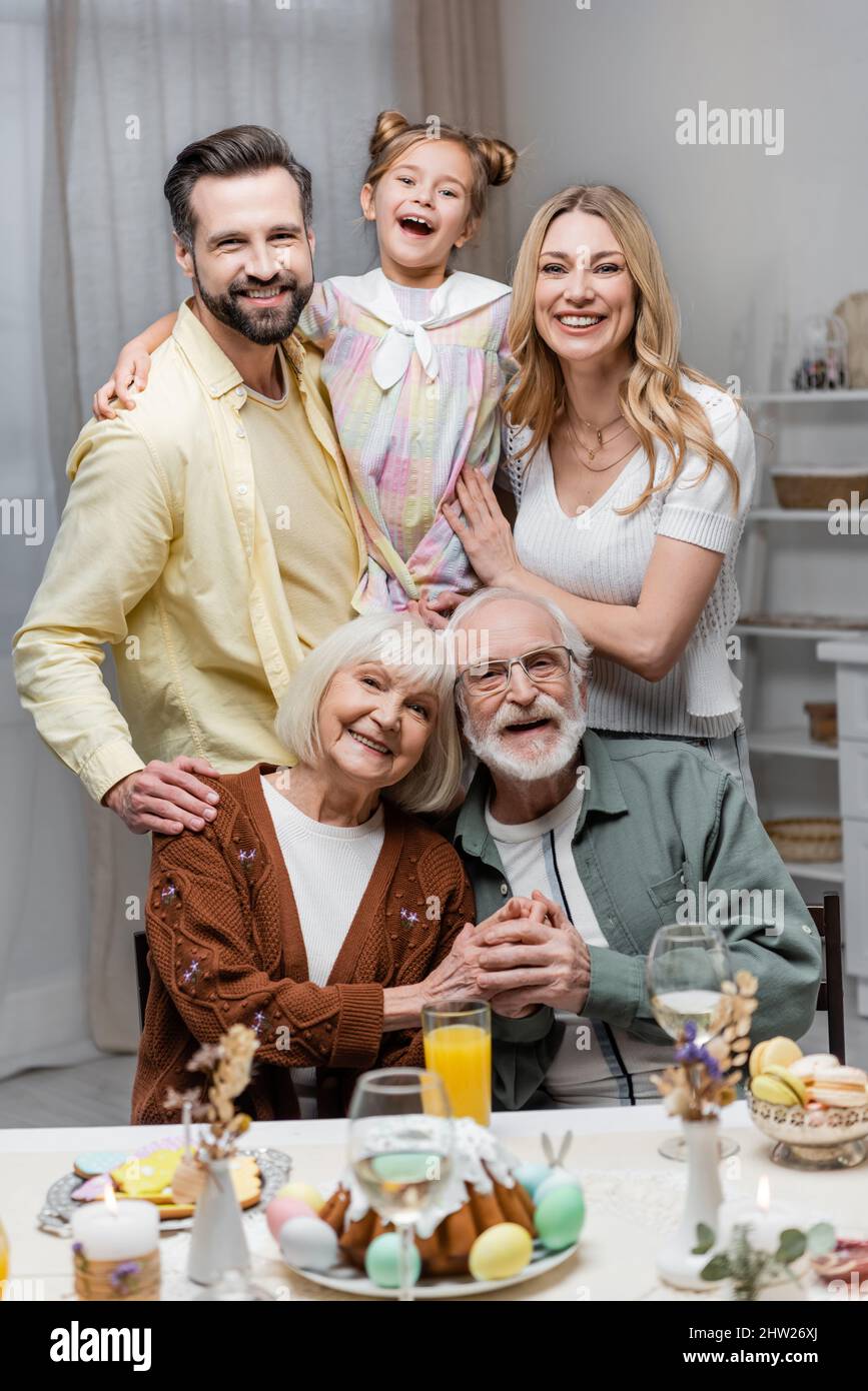 cheerful family looking at camera during easter celebration,stock image Stock Photo