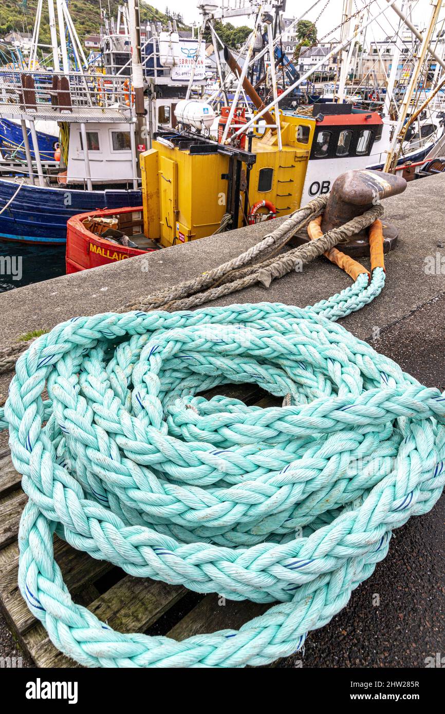 A coil of polypropylene rope on the quayside in the harbour at Mallaig, Highland, Scotland UK Stock Photo