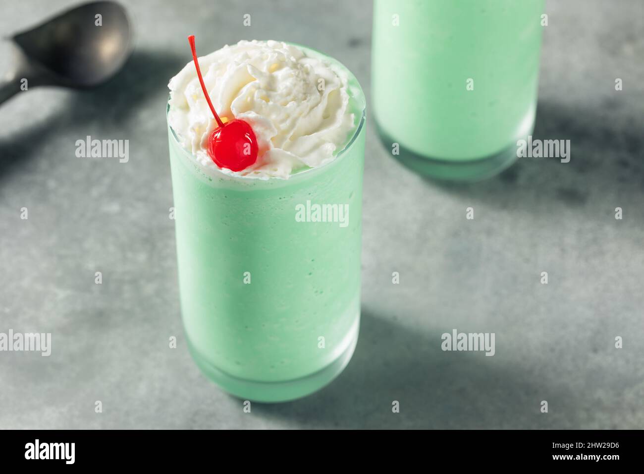Homemade St Patricks Mint Milkshake with Whipped Cream Stock Photo
