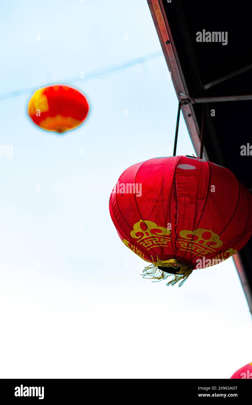 Vertical shot of Chinese lanterns on the blurry background Stock Photo ...