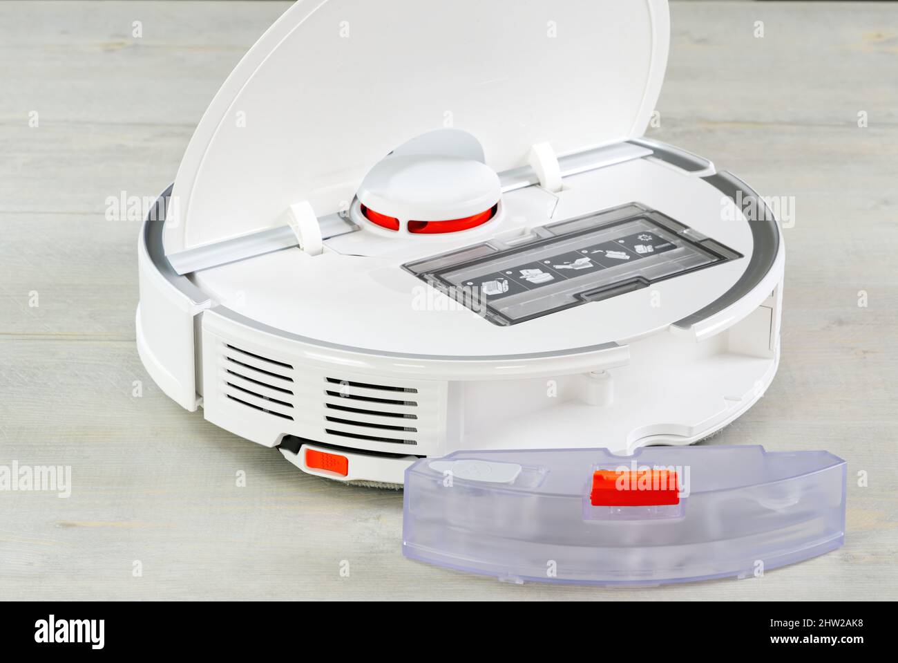 robot vacuum cleaner water tank removed and the filter lid is opened to