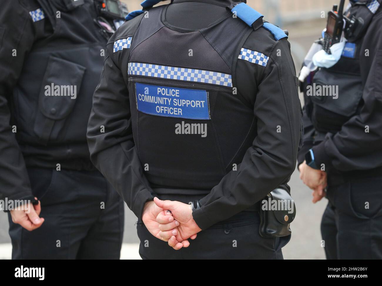 PCSO Police community support officer on duty in Hampshire UK, pictured from behind. Stock Photo
