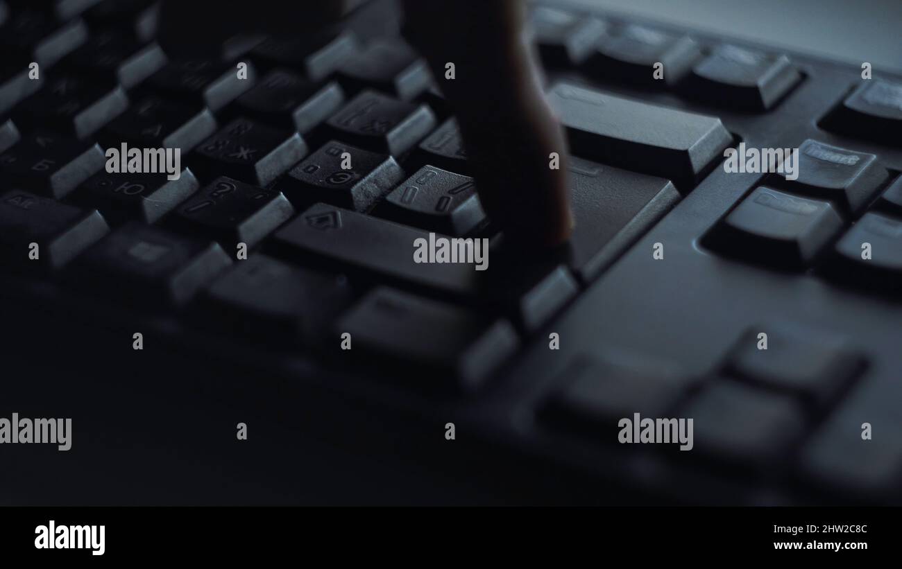 Man Pressing Button On Computer Close-up man presses keyboard key. Man presses button enter computer ...