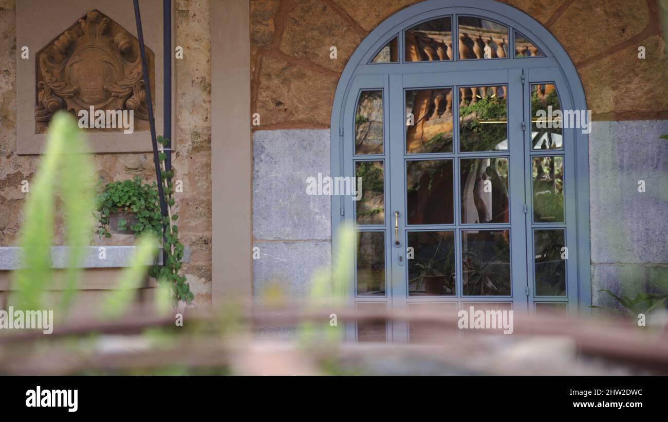 Beautiful old wooden door with glass. Art. Glass door with wooden frame. Vintage entrance to the
