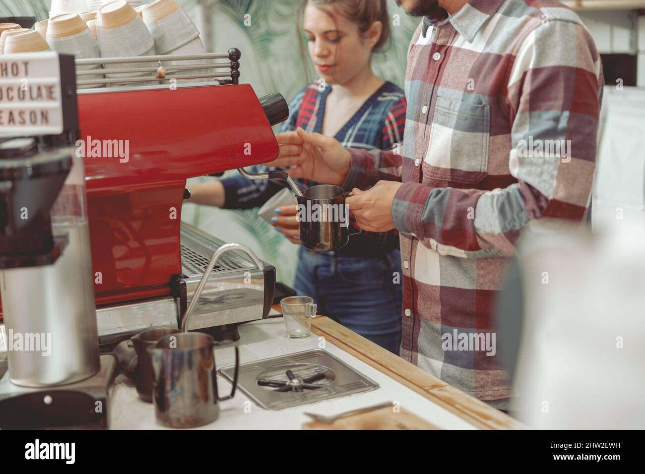 The process of whipping milk in coffee machine Stock Photo Alamy